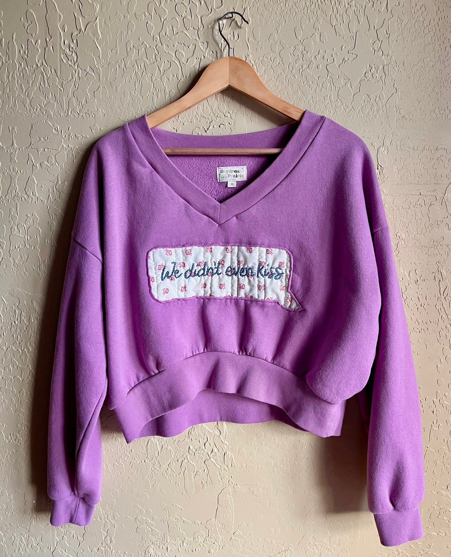 “We Didn’t Even Kiss” Embroidered Cropped V-Neck - Medium